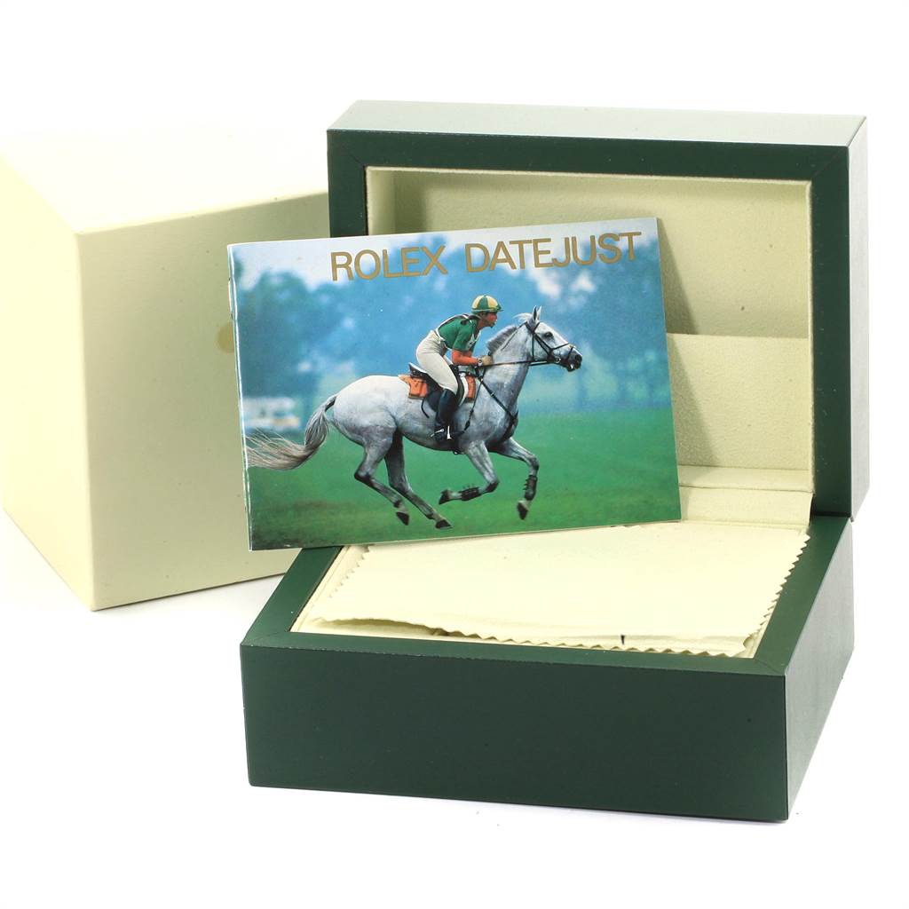 The image shows an open Rolex Datejust 16200 Men's Stainless Steel Blue Dial 16200 Men's Stainless Steel Blue Dial box with a booklet featuring a horse rider on top.