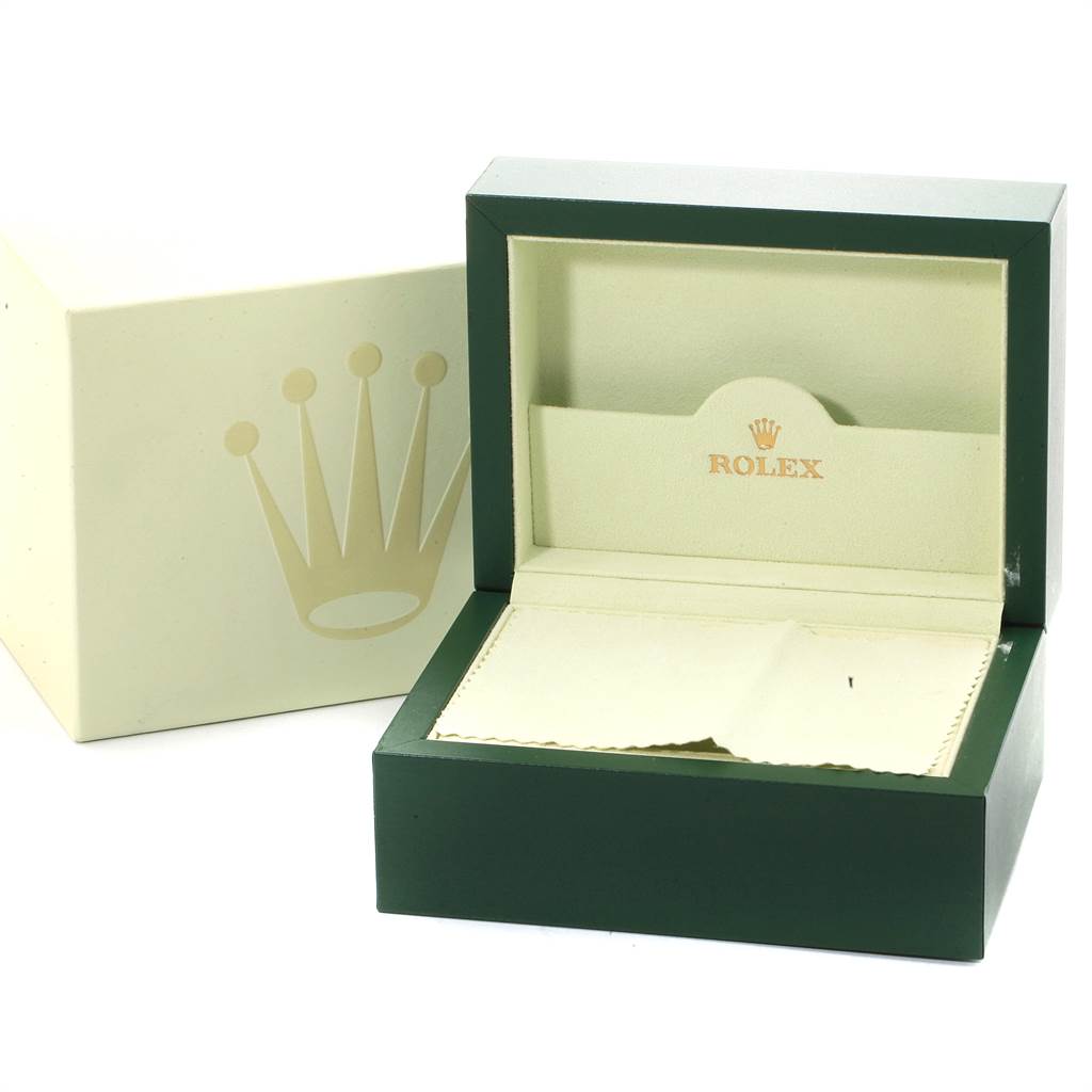 This image shows an empty open green Rolex Datejust 116234 Men's Stainless Steel Black Dial 116234 Men's Stainless Steel Black Dial watch box with a cleaning cloth, alongside its white outer box.