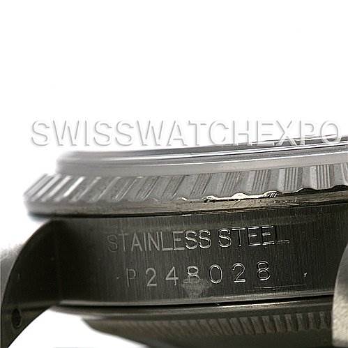 This image shows a close-up side angle of the case and bezel of a Rolex Datejust 16200 Men's Stainless Steel Black Dial 16200 Men's Stainless Steel Black Dial watch, with the serial number visible.