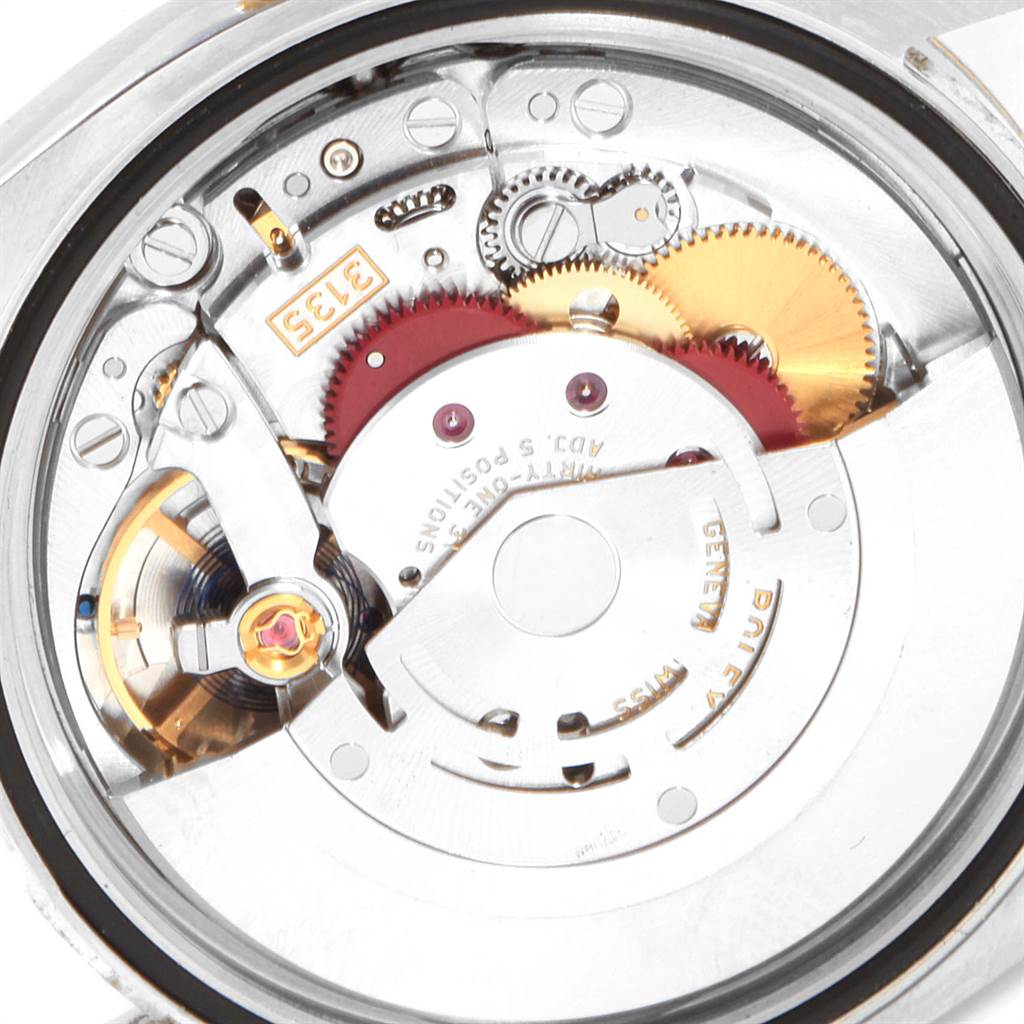This image shows a close-up view of the movement mechanism of a Rolex Datejust 116233 Men's Steel and Gold (two tone) Silver Dial 116233 Men's Steel and Gold (two tone) Silver Dial watch.