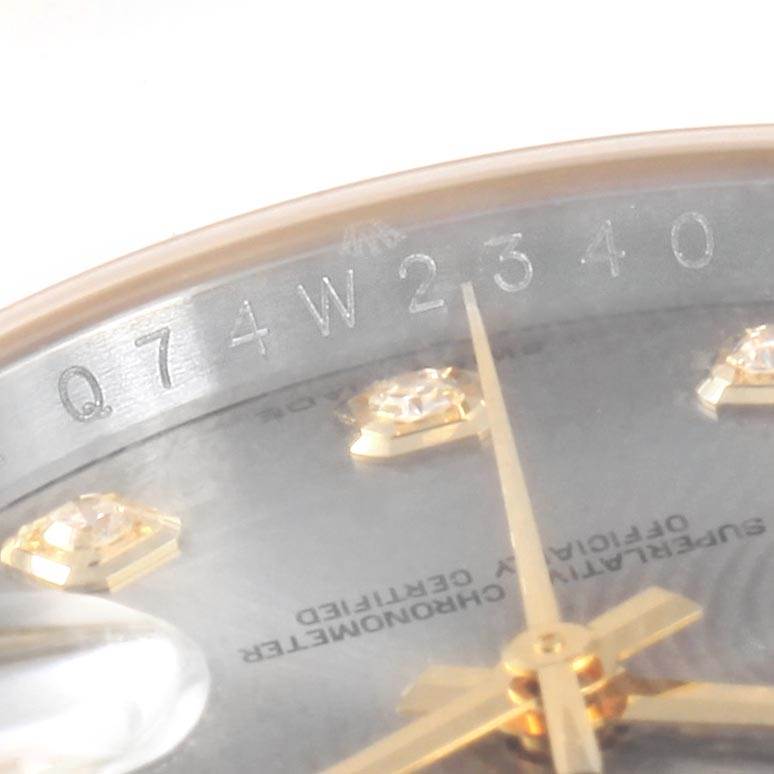 The image shows an angled close-up of the Rolex Datejust 116233 Men's Steel and Gold (two tone) Silver Dial 116233 Men's Steel and Gold (two tone) Silver Dial dial, highlighting the diamonds, hands, and serial number.