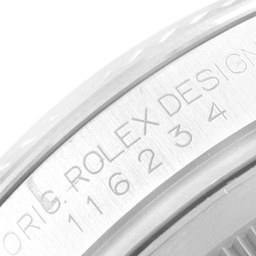 The image shows a close-up of the engraved bezel and case side of a Rolex Datejust 116234 Men's Stainless Steel Blue Dial 116234 Men's Stainless Steel Blue Dial watch.