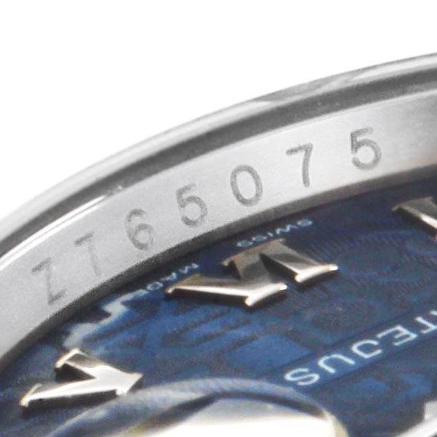 Close-up of the Rolex Datejust 116234 Men's Stainless Steel Blue Dial 116234 Men's Stainless Steel Blue Dial model showing the serial number engraved on the inner bezel and part of the watch dial.