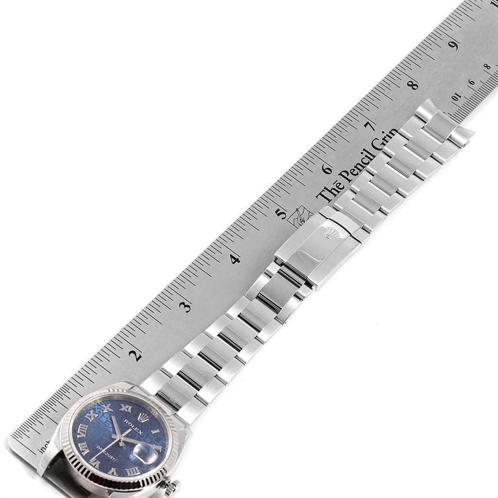 The image shows the Rolex Datejust 116234 Men's Stainless Steel Blue Dial 116234 Men's Stainless Steel Blue Dial watch lying flat next to a ruler, with the dial, bezel, and bracelet visible.