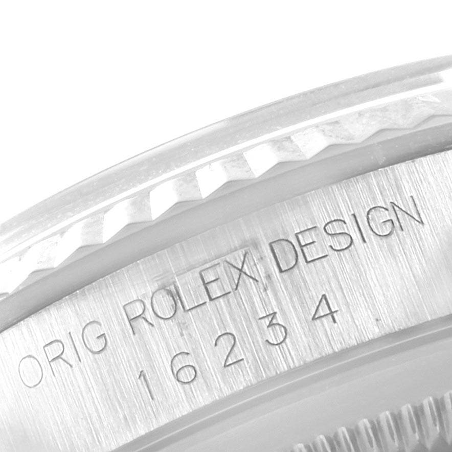 The image shows a close-up of the case side of the Rolex Datejust 16234 Men's Stainless Steel Silver Dial 16234 Men's Stainless Steel Silver Dial, highlighting the engraving "ORIG ROLEX DESIGN 16234."