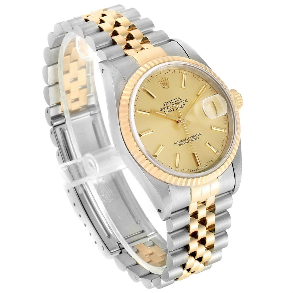 The Rolex Datejust 16233 Men's Steel and Gold (two tone) Champagne Dial 16233 Men's Steel and Gold (two tone) Champagne Dial watch is shown at a slight angle, highlighting its face, bracelet, and clasp.