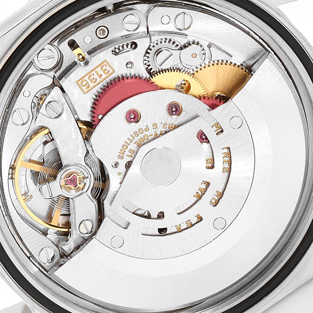 The image shows the intricate inner mechanism of a Rolex Datejust 16233 Men's Steel and Gold (two tone) Champagne Dial 16233 Men's Steel and Gold (two tone) Champagne Dial model from a close-up angle.