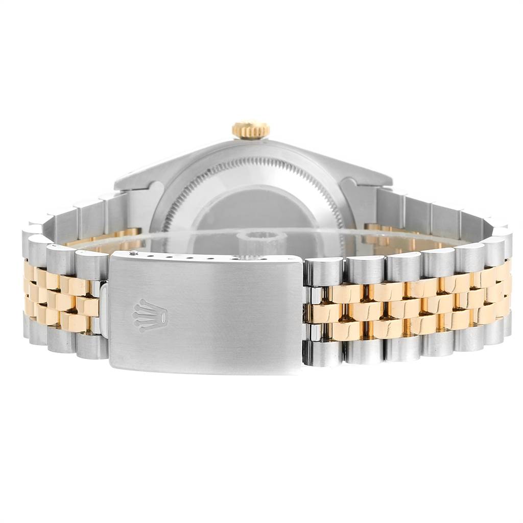 This image shows the back view of a Rolex Datejust 16233 Men's Steel and Gold (two tone) Champagne Dial 16233 Men's Steel and Gold (two tone) Champagne Dial model, highlighting its bicolor bracelet and clasp.