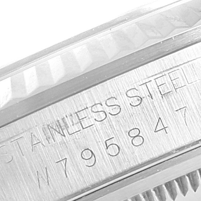 The image shows an angled view of the serial number and stainless steel engraving on the side of a Rolex Datejust 16234 Men's Stainless Steel White Dial 16234 Men's Stainless Steel White Dial watch.