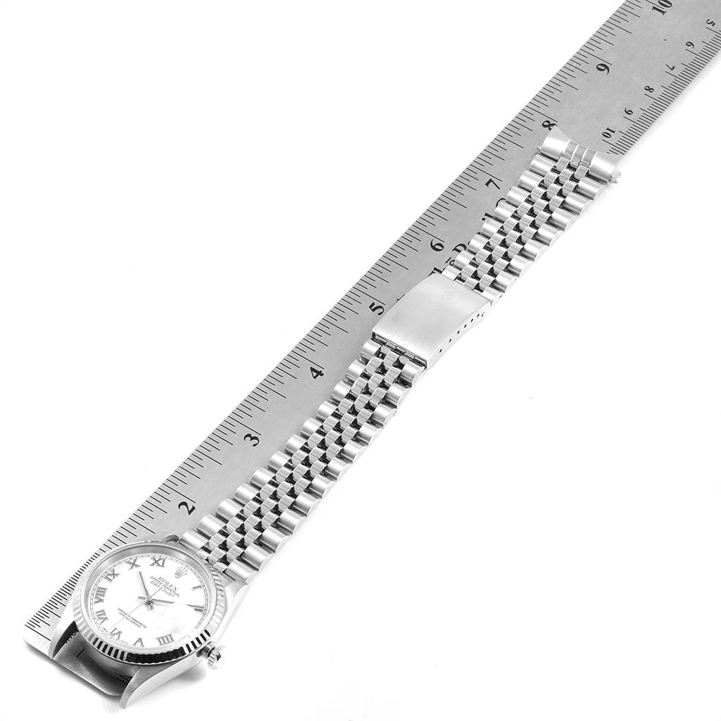 The Rolex Datejust 16234 Men's Stainless Steel White Dial 16234 Men's Stainless Steel White Dial watch is shown from the top view, including the face, bezel, bracelet, clasp, and a ruler for measurement.