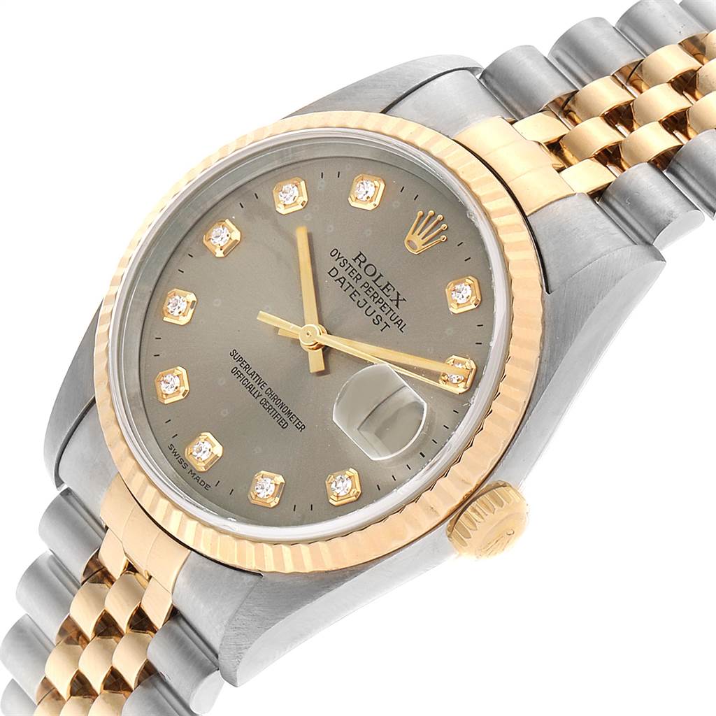 The Rolex Datejust 16233 Men's Steel and Gold (two tone) Silver Dial 16233 Men's Steel and Gold (two tone) Silver Dial watch is shown at an angle highlighting the dial, bezel, crown, and part of the bracelet.