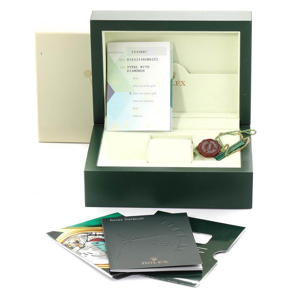 The image shows an open Rolex Datejust 16233 Men's Steel and Gold (two tone) Silver Dial 16233 Men's Steel and Gold (two tone) Silver Dial watch box with accessories, including a tag, booklets, and a certificate.