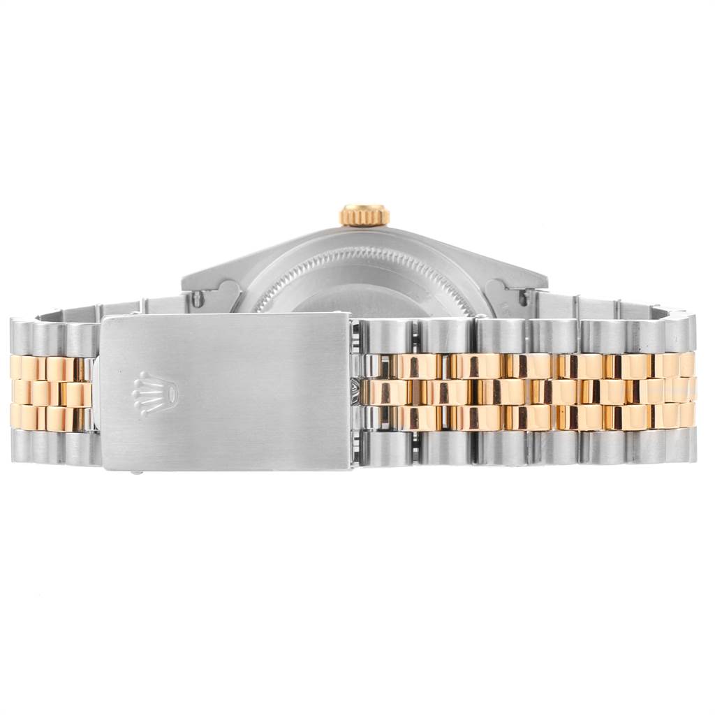 The image shows the back side of the Rolex Datejust 16233 Men's Steel and Gold (two tone) Silver Dial 16233 Men's Steel and Gold (two tone) Silver Dial watch, highlighting the jubilee bracelet and clasp with the Rolex crown logo.