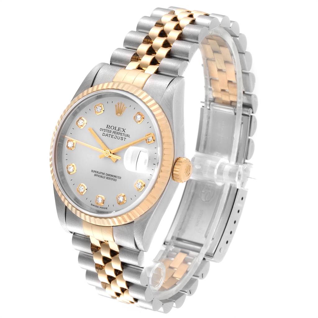 This image shows a Datejust Rolex watch with a silver and gold dial and a two-tone band from a front-side angle.