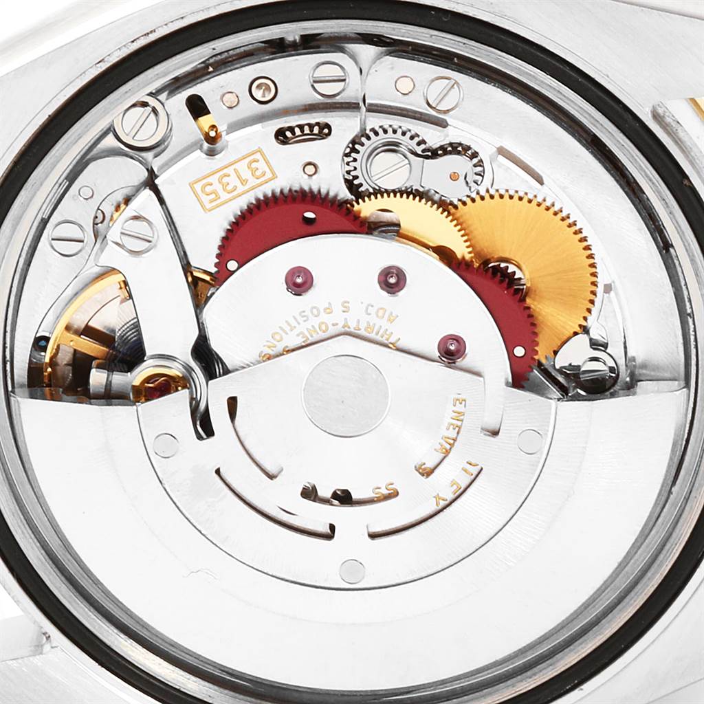 Close-up of the Rolex Datejust 116243 Men
s Steel and Gold (two tone) Champagne Dial 116243 Men
s Steel and Gold (two tone) Champagne Dial watch movement, highlighting gears and internal mechanisms.