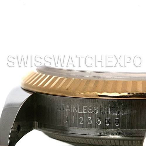 The image shows a close-up of the side profile of a Rolex Datejust 116233-SRJ Men
s Stainless Steel Silver Dial 116233-SRJ Men
s Stainless Steel Silver Dial watch, highlighting the stainless steel casing and fluted bezel.