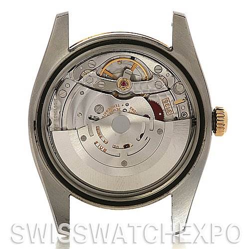 The image shows the back view of a Rolex Datejust 116233-SRJ Men
s Stainless Steel Silver Dial 116233-SRJ Men
s Stainless Steel Silver Dial watch, highlighting its internal mechanical movement.