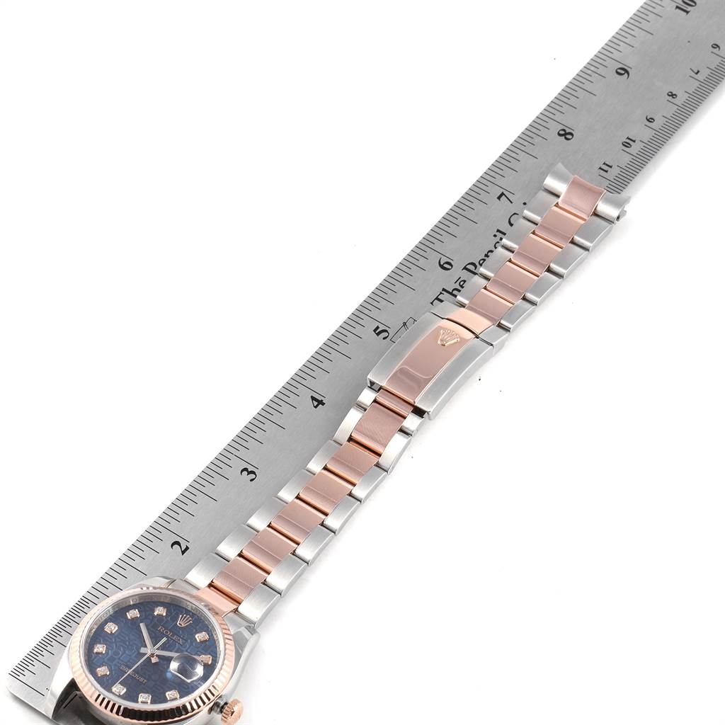 The image shows a Rolex Datejust 116231 Men's Steel and Gold (two tone) Blue Dial 116231 Men's Steel and Gold (two tone) Blue Dial watch laid flat with a ruler measuring the length of its bracelet.