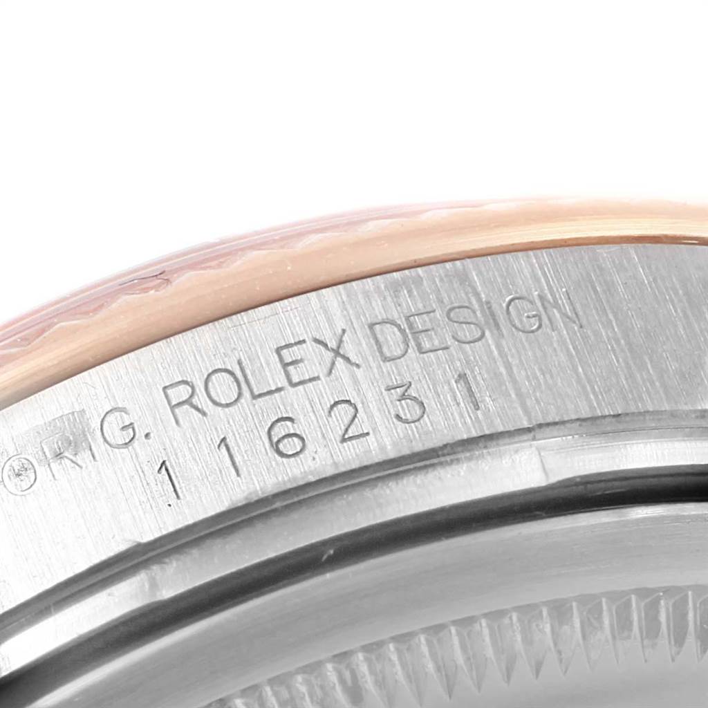 This image shows a close-up of the case side of a Rolex Datejust 116231 Men's Steel and Gold (two tone) Blue Dial 116231 Men's Steel and Gold (two tone) Blue Dial, displaying the engraved reference number.