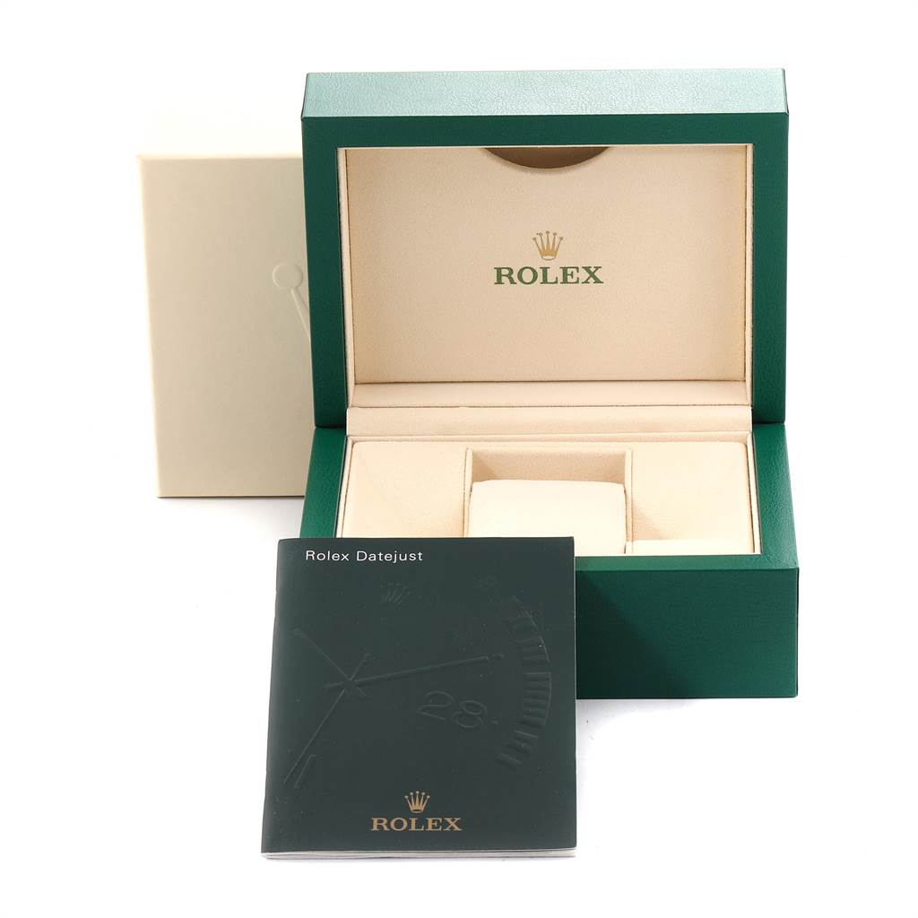 The image shows an open Rolex Datejust 116231 Men's Steel and Gold (two tone) Blue Dial 116231 Men's Steel and Gold (two tone) Blue Dial watch box with a manual resting in front.