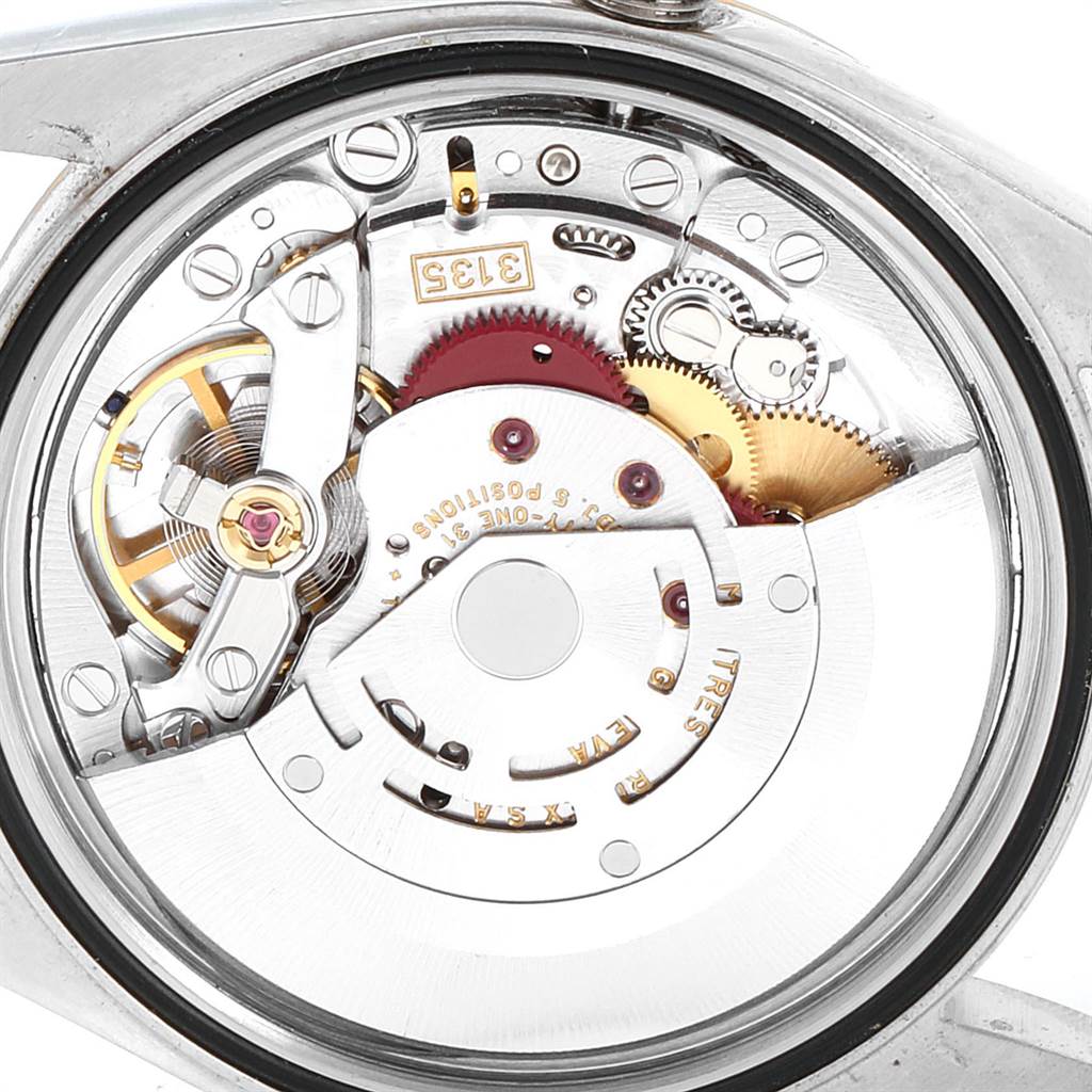 This image shows a close-up, internal view of the Rolex Datejust 16233 Men's Steel and Gold (two tone) Grey Dial 16233 Men's Steel and Gold (two tone) Grey Dial mechanical movement and gears.