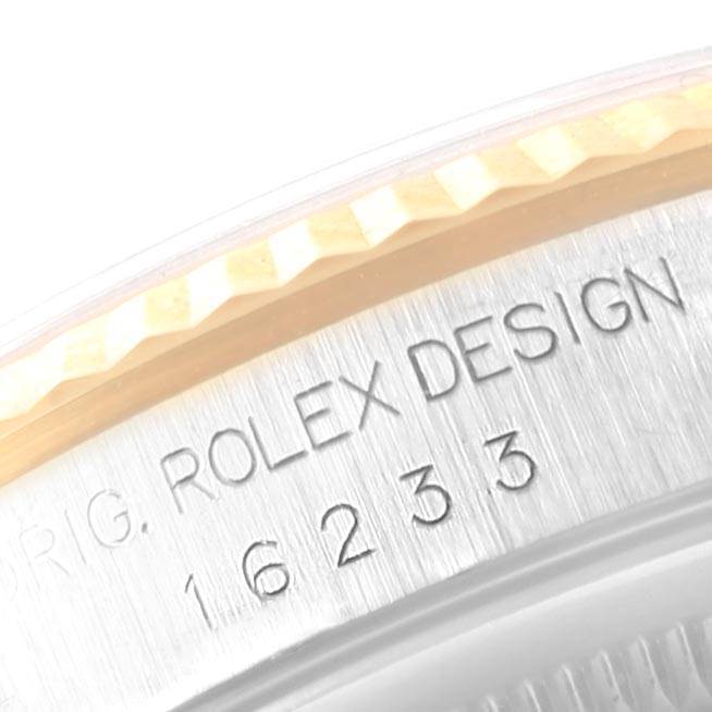The image shows a close-up of the engraved bezel and reference number on a Rolex Datejust 16233 Men's Steel and Gold (two tone) Grey Dial 16233 Men's Steel and Gold (two tone) Grey Dial watch.