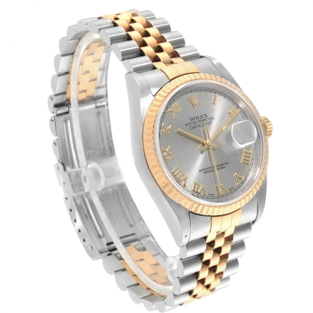 The image shows a Rolex Datejust 16233 Men's Steel and Gold (two tone) Grey Dial 16233 Men's Steel and Gold (two tone) Grey Dial watch at a slight angle, highlighting its two-tone bracelet, fluted bezel, and silver dial with Roman numerals.