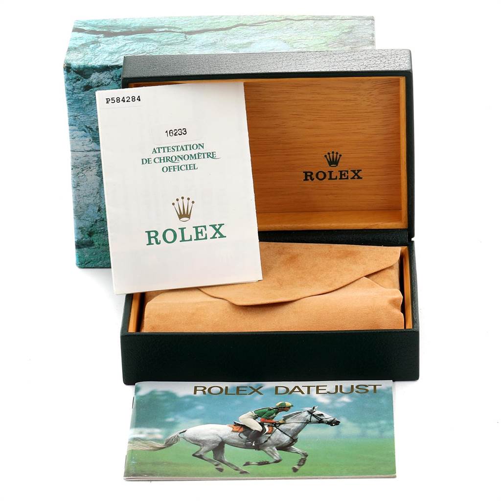 The image shows the open box, warranty card, and booklet for the Rolex Datejust 16233 Men's Steel and Gold (two tone) Grey Dial 16233 Men's Steel and Gold (two tone) Grey Dial model.