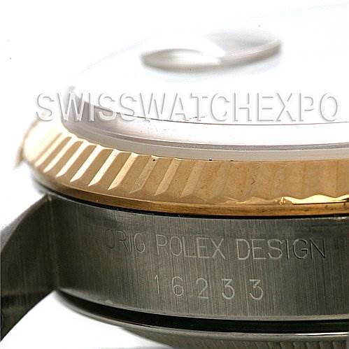 This close-up image of the Rolex Datejust 16233 Men's Stainless Steel Champagne Dial 16233 Men's Stainless Steel Champagne Dial shows the side view of the bezel and part of the engraved case with the model number 16233.
