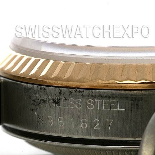 This image shows a close-up view of the side of a Rolex Datejust 16233 Men's Stainless Steel Champagne Dial 16233 Men's Stainless Steel Champagne Dial watch, highlighting the stainless steel case and part of the fluted bezel.