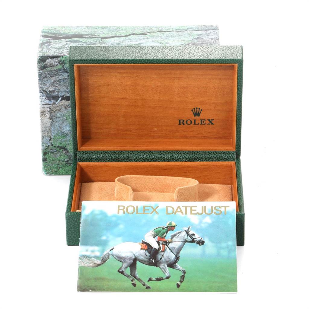 The image shows an open green Rolex watch box for the Datejust model, with an instruction booklet in front.