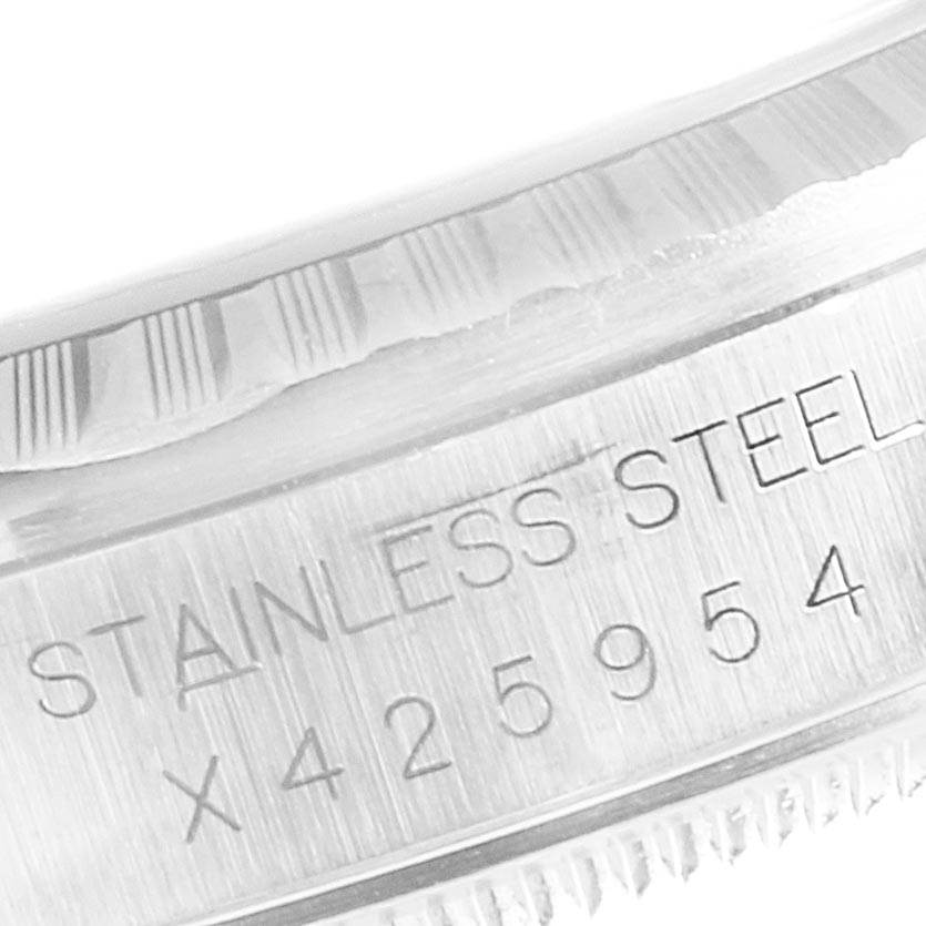 This image shows a close-up of the serial number engraving on the case of a Rolex Datejust 16220 Men's Stainless Steel Blue Dial 16220 Men's Stainless Steel Blue Dial watch.