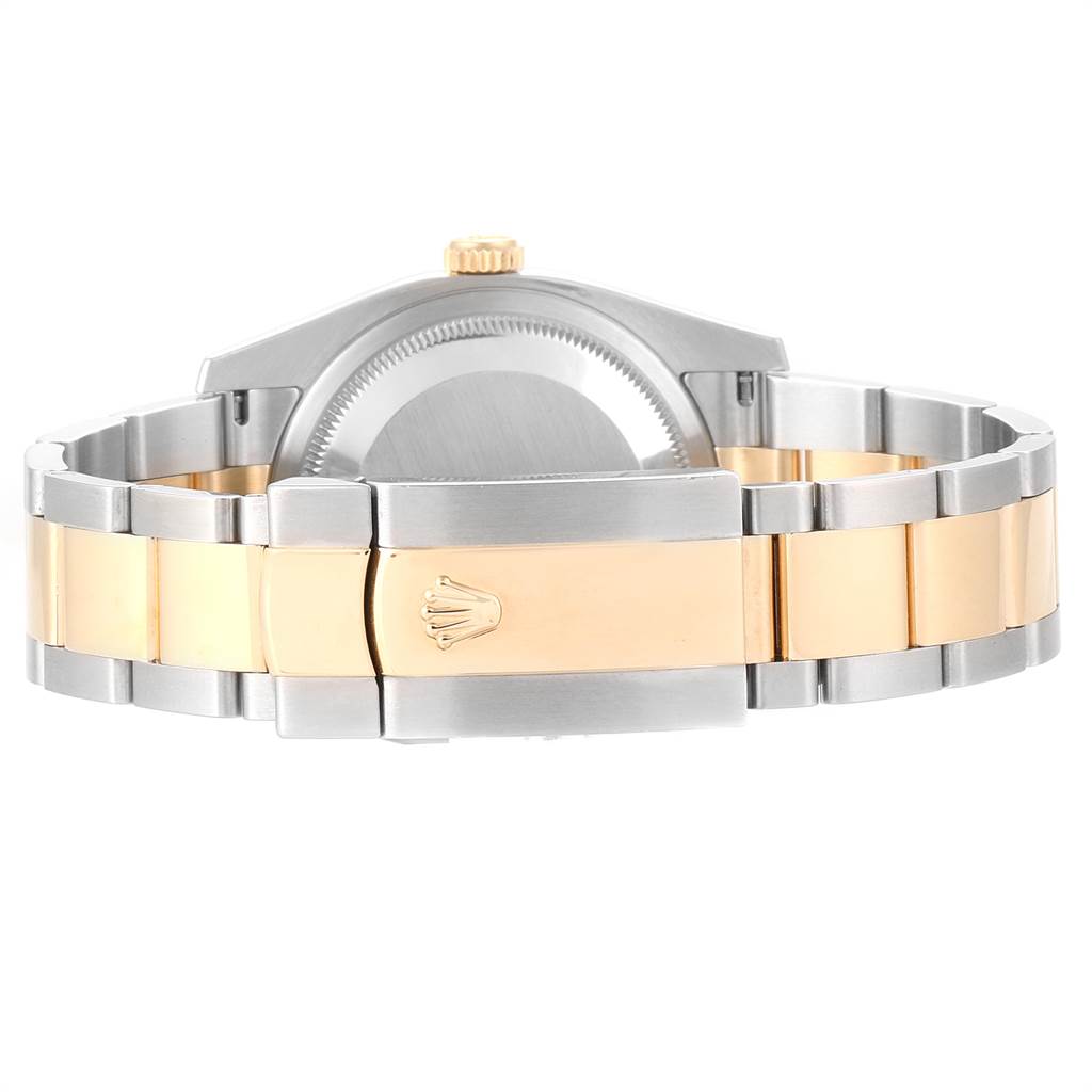 The image shows the back and clasp of a Rolex Datejust 116203 Men
s Stainless Steel Brown Dial 116203 Men
s Stainless Steel Brown Dial watch, highlighting a two-tone metal bracelet.