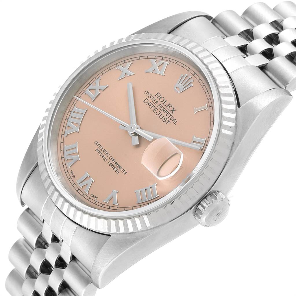 This image shows a close-up, angled view of the dial, crown, and part of the bracelet of the Rolex Datejust 16234 Men
s Stainless Steel Pink Dial 16234 Men
s Stainless Steel Pink Dial watch.