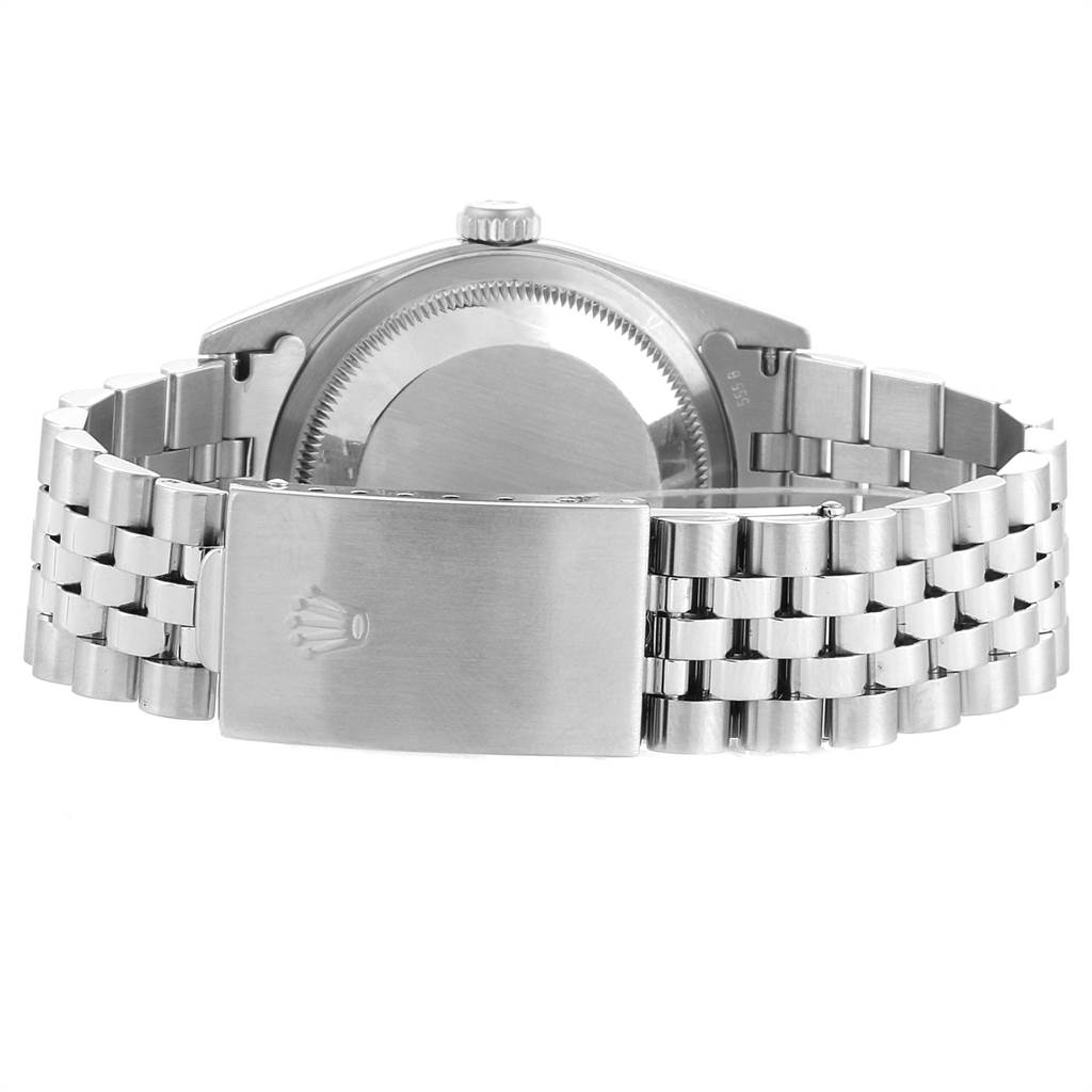 The image shows the back view of a Rolex Datejust 16234 Men
s Stainless Steel Pink Dial 16234 Men
s Stainless Steel Pink Dial watch, focusing on the case back and bracelet clasp.