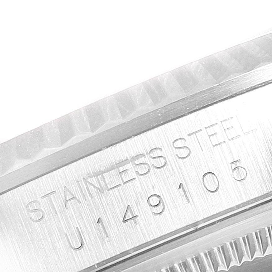 This close-up image shows the engraved serial number and "STAINLESS STEEL" inscription on the side of a Rolex Datejust 16234 Men's Stainless Steel Silver Dial 16234 Men's Stainless Steel Silver Dial watch case.