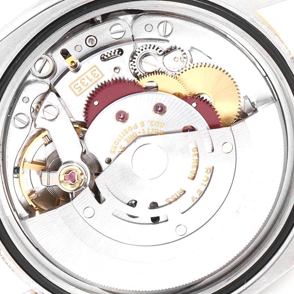 This is an internal view of the Rolex Datejust 116243 Men
s Steel and Gold (two tone) Champagne Dial 116243 Men
s Steel and Gold (two tone) Champagne Dial watch, showing its intricate mechanical movement components.