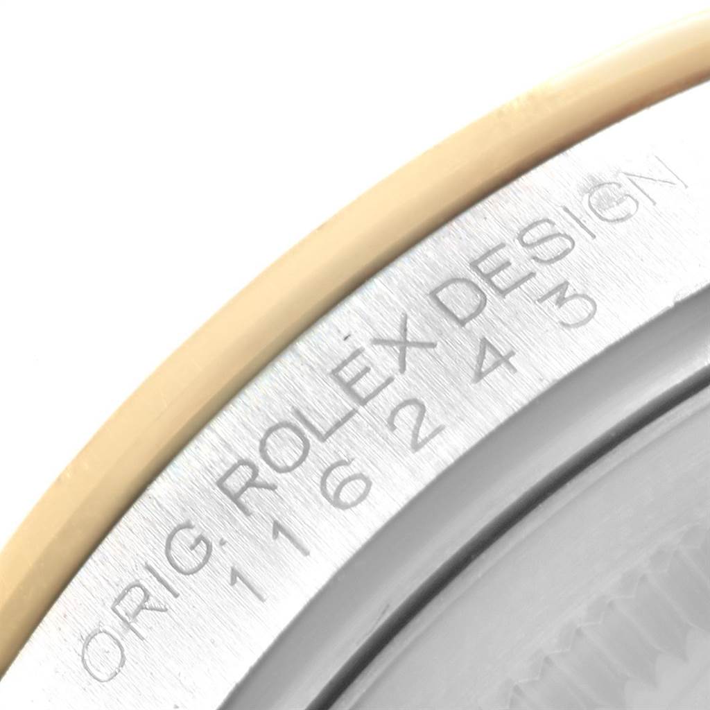 Close-up view of the Rolex Datejust 116243 Men
s Steel and Gold (two tone) Champagne Dial 116243 Men
s Steel and Gold (two tone) Champagne Dial watch, showing the engraved markings on the watch case.