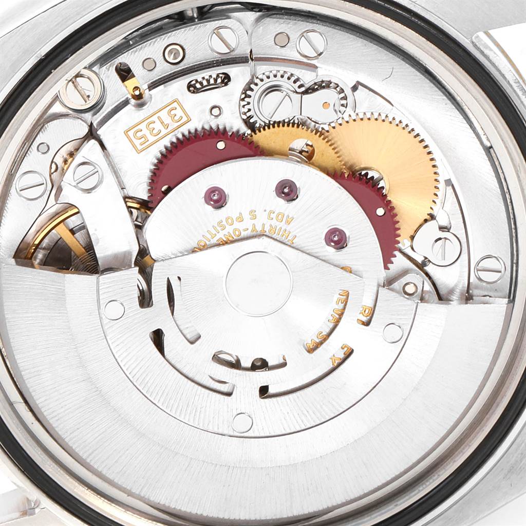 This image shows the intricate, inner mechanical movement of a Rolex Datejust 116233 Men's Stainless Steel Champagne Dial 116233 Men's Stainless Steel Champagne Dial watch.