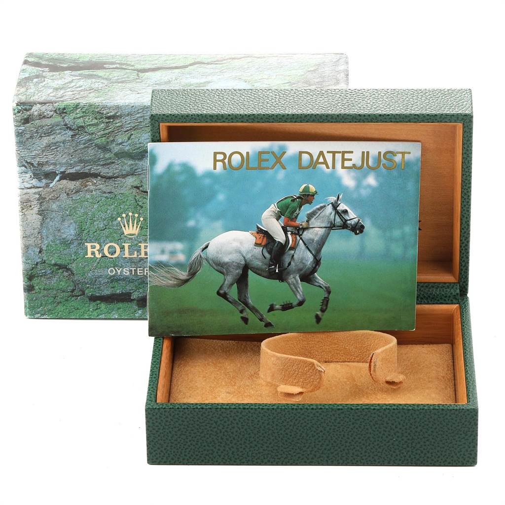 A Rolex Datejust 16233 Men's Steel and Gold (two tone) White Dial 16233 Men's Steel and Gold (two tone) White Dial watch box is shown at an angle, featuring the interior cushion and outer packaging with a booklet on top.