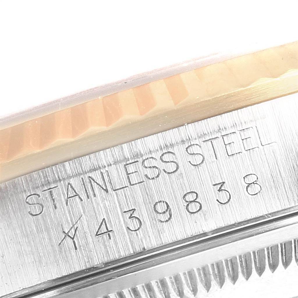 The image shows a close-up of the case side of a Rolex Datejust 16233 Men's Steel and Gold (two tone) White Dial 16233 Men's Steel and Gold (two tone) White Dial watch, displaying the stainless steel engraving and serial number.