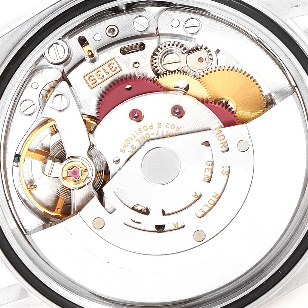 The image shows the inner mechanical movement with gears of the Rolex Datejust 16233 Men's Steel and Gold (two tone) White Dial 16233 Men's Steel and Gold (two tone) White Dial model watch.