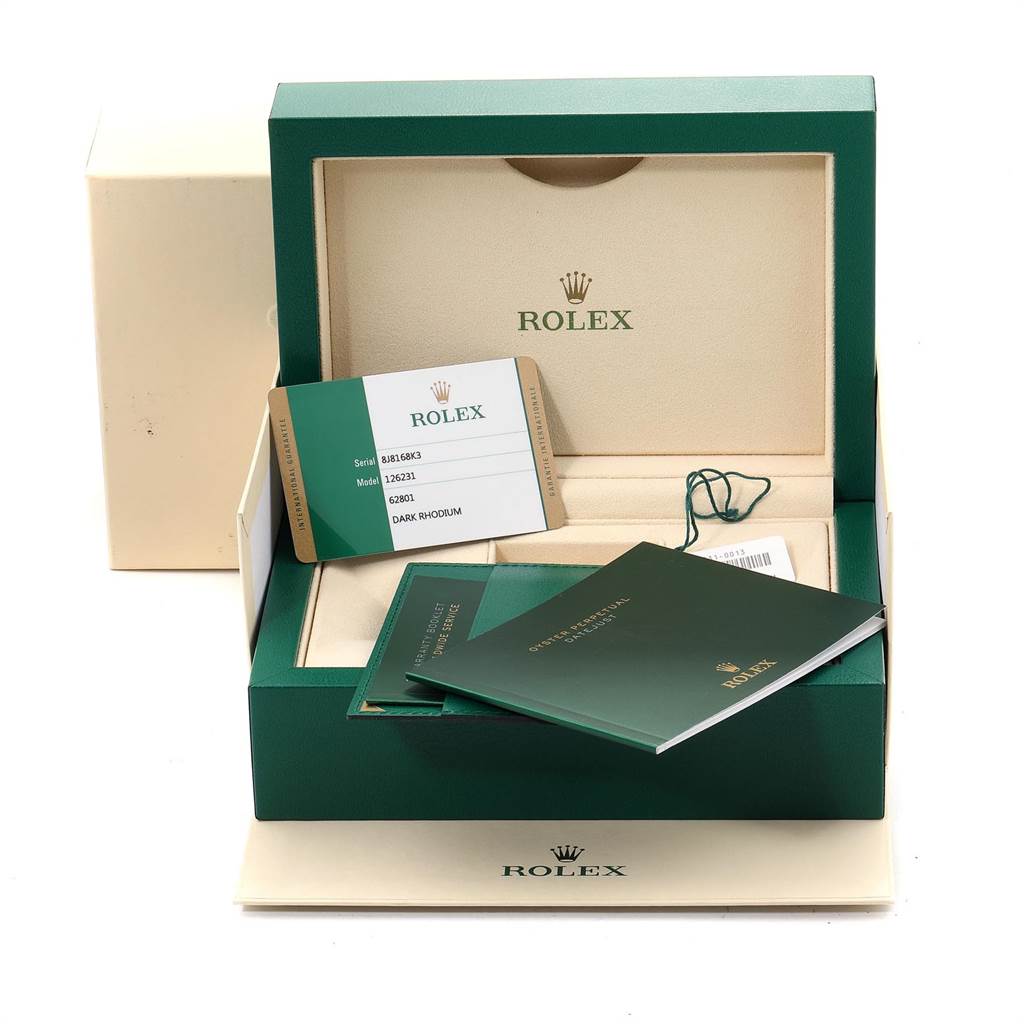 The image shows the accessories of a Rolex Datejust 126231 Men
s Steel and Gold (two tone) Grey Dial 126231 Men
s Steel and Gold (two tone) Grey Dial, including its box, warranty card, and instruction manuals from a front angle.