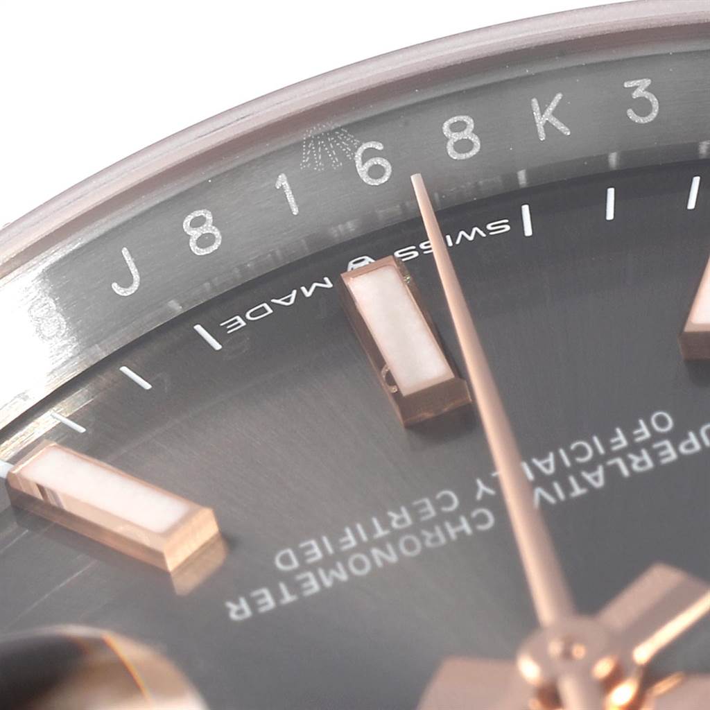 The close-up image of the Rolex Datejust 126231 Men
s Steel and Gold (two tone) Grey Dial 126231 Men
s Steel and Gold (two tone) Grey Dial watch shows the dial, hour markers, and part of the hands.