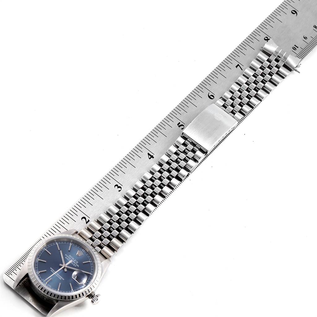 The image shows a top view of a Rolex Datejust 16220 Men's Stainless Steel Blue Dial 16220 Men's Stainless Steel Blue Dial watch featuring the dial, case, and bracelet measured against a ruler.