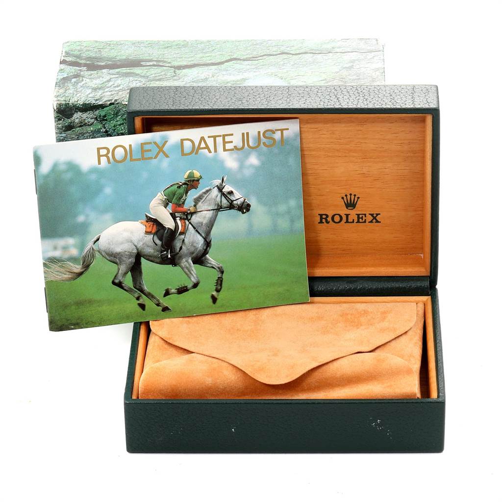 The image shows the packaging and a booklet for the Rolex Datejust 16220 Men's Stainless Steel Blue Dial 16220 Men's Stainless Steel Blue Dial watch.