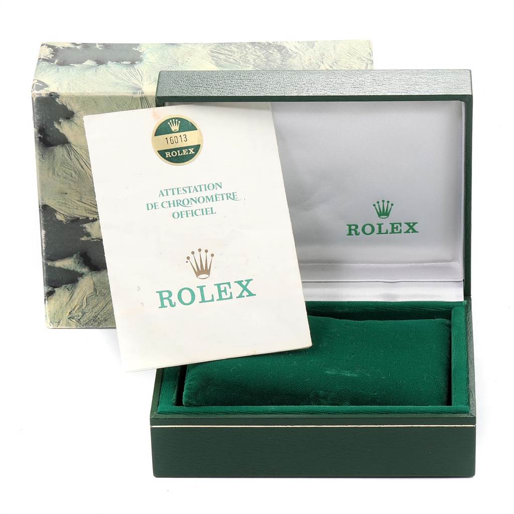 The image shows an open Rolex watch box with a Datejust model certification card inside.