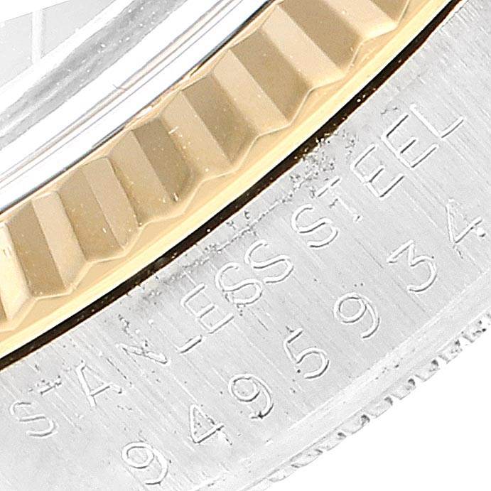 The image shows a close-up of the bezel and part of the case back with engraving on a Rolex Datejust 16013 Men's Stainless Steel Black Dial 16013 Men's Stainless Steel Black Dial watch.