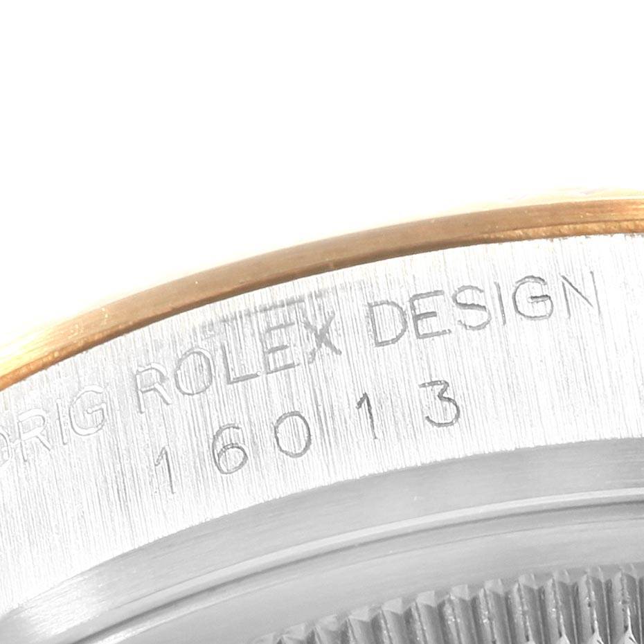 This image shows a close-up of the engraved case and bezel of a Rolex Datejust 16013 Men's Stainless Steel Black Dial 16013 Men's Stainless Steel Black Dial model, partially displaying its serial number "16013".
