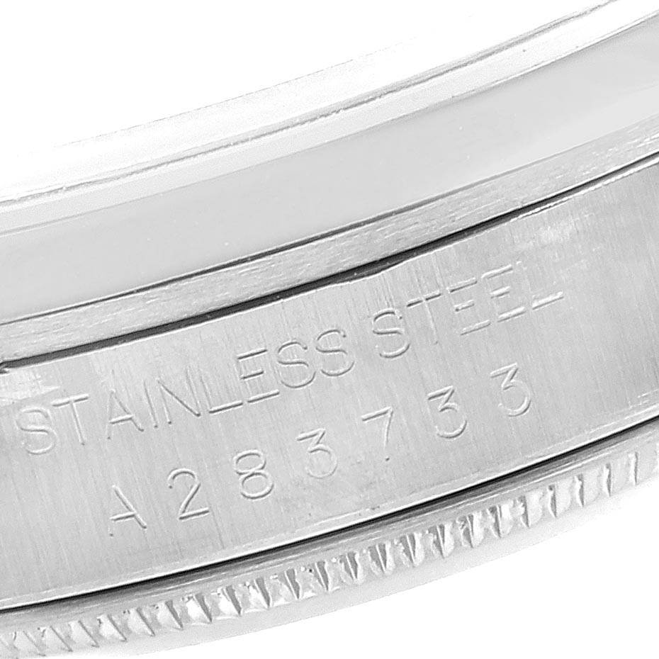 This close-up shows the inner case and part of the bezel of a Rolex Datejust 16200 Men's Stainless Steel Black Dial 16200 Men's Stainless Steel Black Dial with the inscription "STAINLESS STEEL A283733."